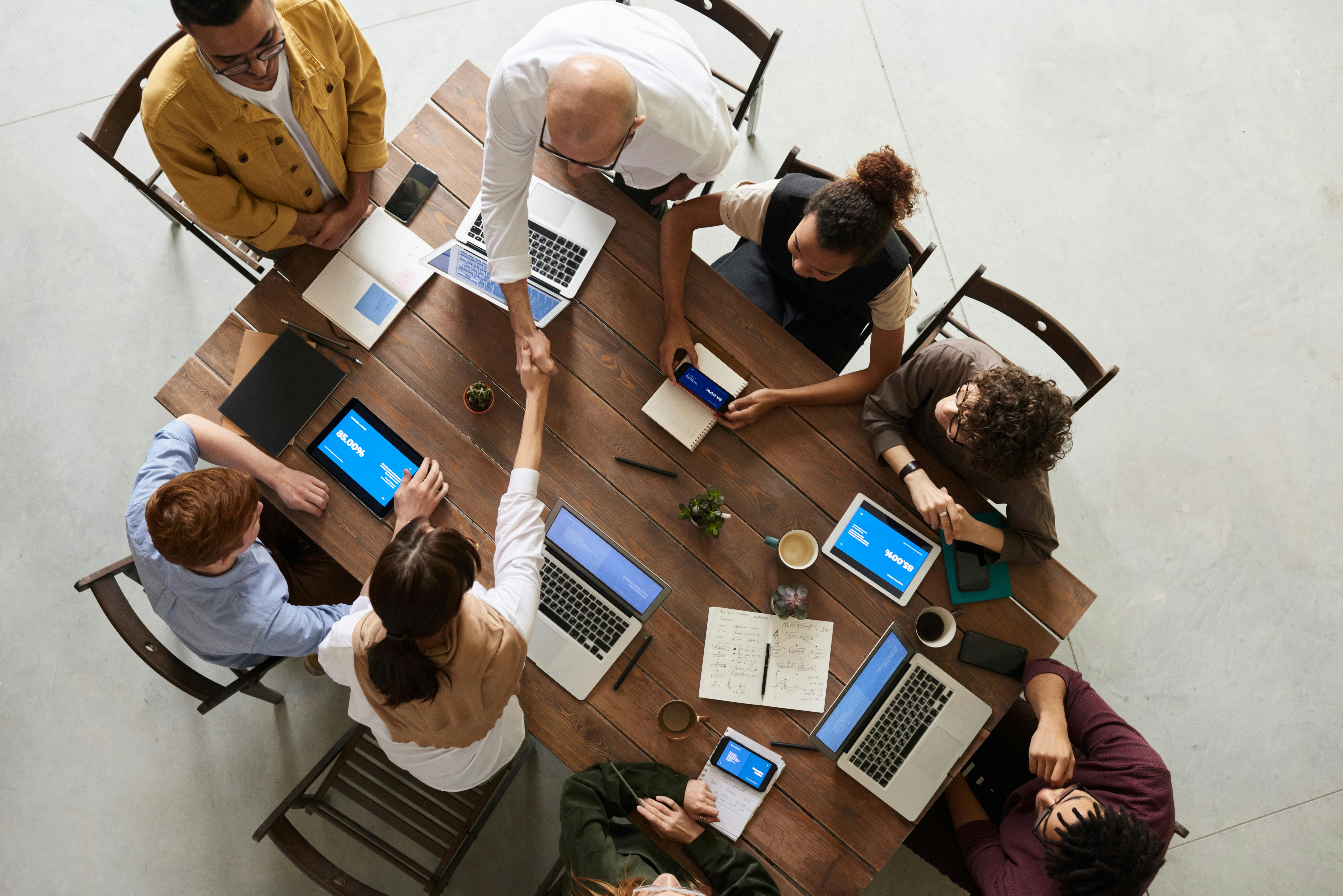 Team members meeting at a conference table.